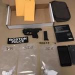 A handgun, bags of cocaine, and other evidence Boston police recovered.